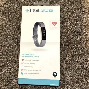 Small, black Fitbit, comes with charger.